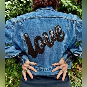 One of a kind- cropped jean jacket
Sequin patch and ruffle details